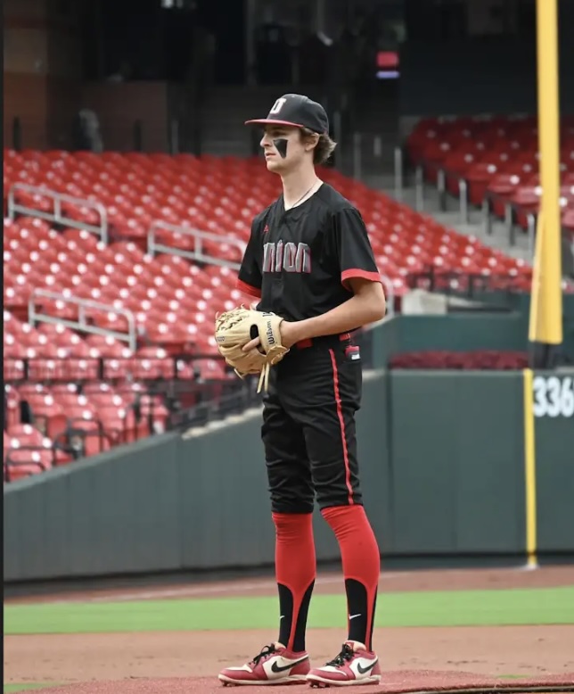Union Knights baseball player stands ready in the infield.