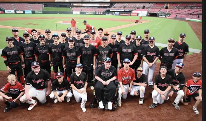 Union Knights baseball players pose together on the field at Busch Stadium during a special team outing.