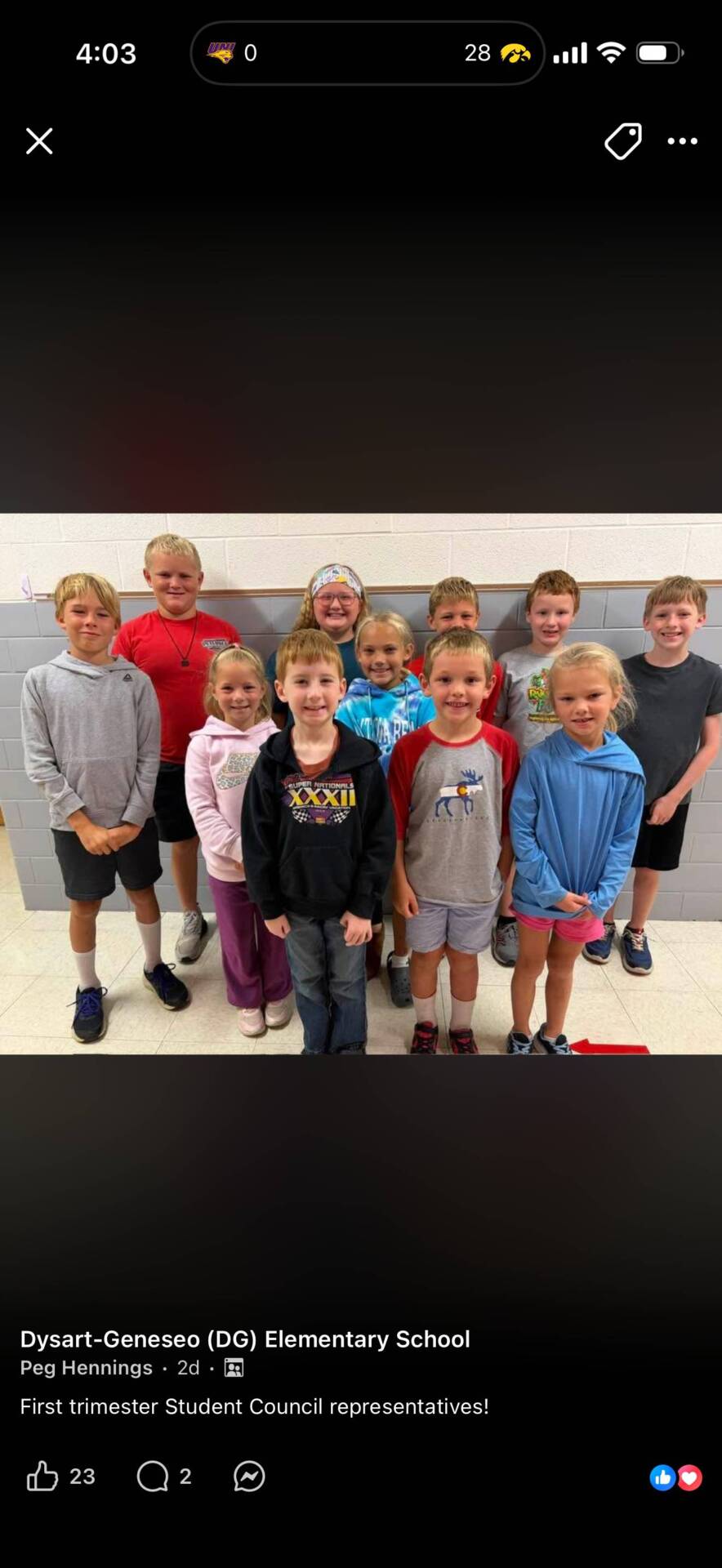 A group of elementary students pose together for a photo celebrating first-trimester student council representatives.