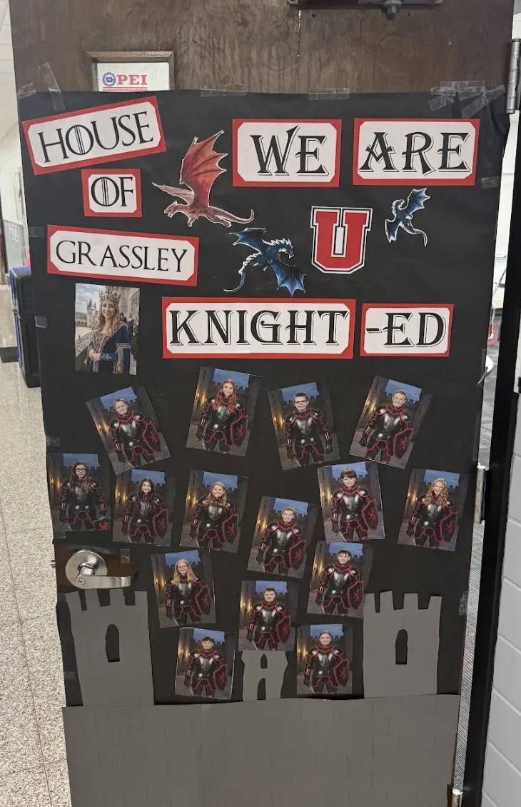 Classroom door decorated with a “House of Grassley: We Are U Knight-ed” theme, featuring dragons, student photos, and a castle.